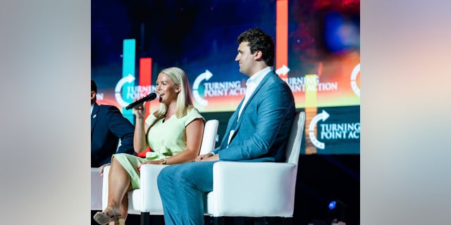 Karoline Leavitt has been endorsed by Turning Point USA founder and President Charlie Kirk, right.