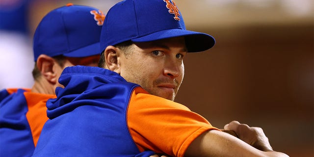 Jacob deGrom of the New York Mets watches from the dugout during a game against the Milwaukee Brewers at Citi Field, June 14, 2022, in New York City.