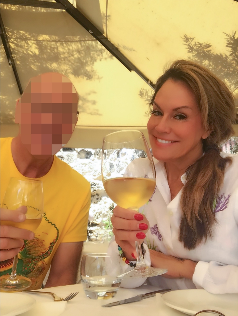 Gweneth Lee sips wine with one of her suitors. 