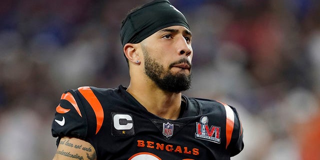 FILE - Cincinnati Bengals free safety Jessie Bates III walks on the field before the second half of the NFL Super Bowl 56 football game against the Los Angeles Rams Sunday, Feb. 13, 2022, in Inglewood, Calif. Bates, who has been in a contract dispute with the team, reported to camp Tuesday, Aug. 23, 2022, and signed a one-year contract with the franchise tag.