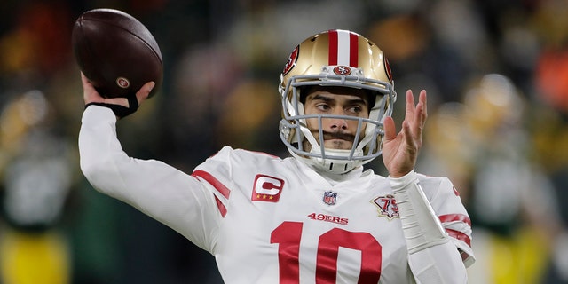 San Francisco 49ers' Jimmy Garoppolo warms up before the NFC divisional playoff game against the Green Bay Packers on Jan. 22, 2022, in Green Bay, Wisconsin.