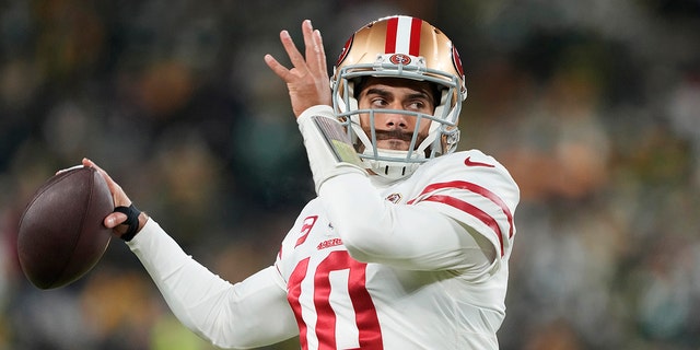 Jimmy Garoppolo of the San Francisco 49ers warms up before the game against the Green Bay Packers in the NFC divisional playoff game at Lambeau Field on Jan. 22, 2022, in Green Bay, Wisconsin.