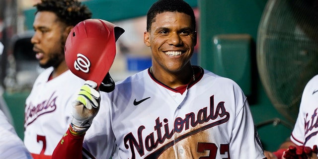 Juan Soto smiles as he celebrates after his solo home against the New York Mets at Nationals Park, Monday, Aug. 1, 2022, in Washington.