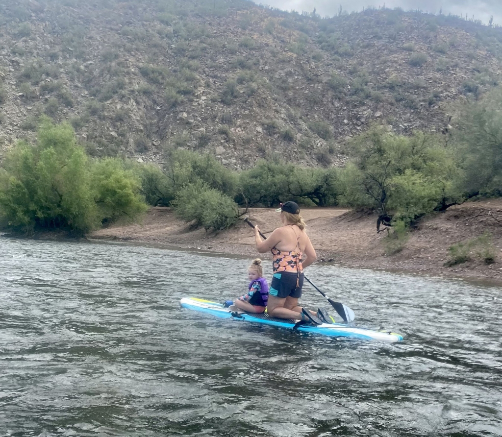 The intrepid nana is seen with her granddaughter while paddleboarding on the Salt River in Tonto National Forest, Arizona. 