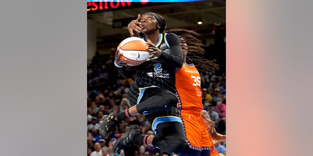 Chicago Sky's Kahleah Copper drives to the basket past Connecticut Sun's Jonquel Jones during the second half in Game 1 of a WNBA basketball semifinal playoff series Sunday, Aug. 28, 2022, in Chicago. The Sun won 68-63.