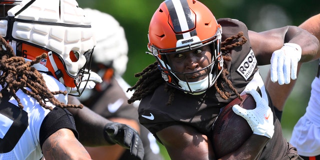 Cleveland Browns running back Kareem Hunt runs with the ball during training camp Wednesday, Aug. 3, 2022, in Berea, Ohio.