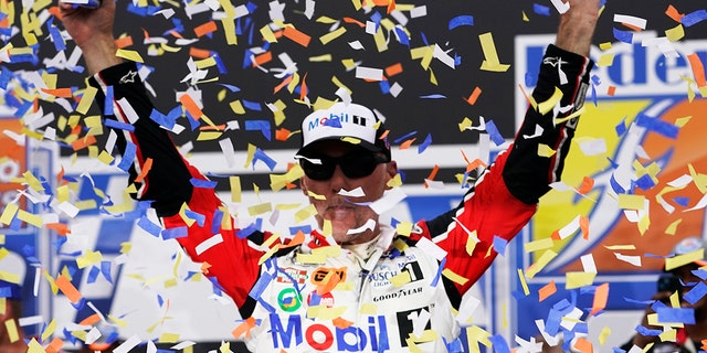 Kevin Harvick celebrates after winning the Federated Auto Parts 400 at Richmond Raceway in Richmond, Virginia, on Aug. 14, 2022.