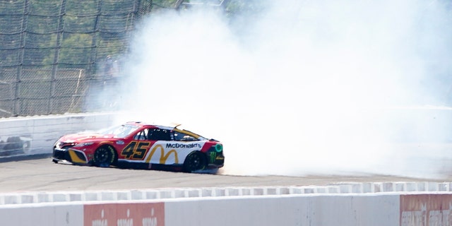 Kurt Busch's No. 45 car spins during qualifying for the NASCAR Cup Series at Pocono Raceway July 23, 2022, in Long Pond, Pa.