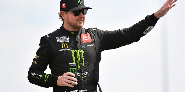 Kurt Busch, driver of the No. 45 Monster Energy Toyota, waves to fans onstage during driver introductions prior to the NASCAR Cup Series Ally 400 at Nashville Superspeedway June 26, 2022, in Lebanon, Tenn.