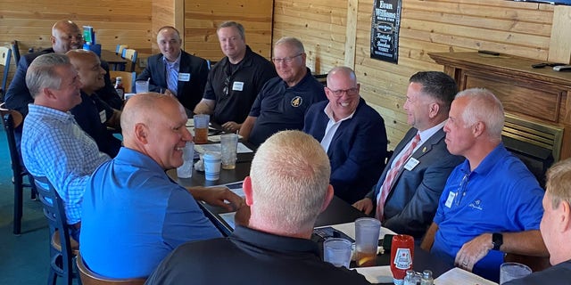 Maryland Gov. Larry Hogan (center-right) and Rep. Don Bacon of Nebraska (left) hold a law enforcement round table discussion, in Omaha, Nebraska on August 10, 2022