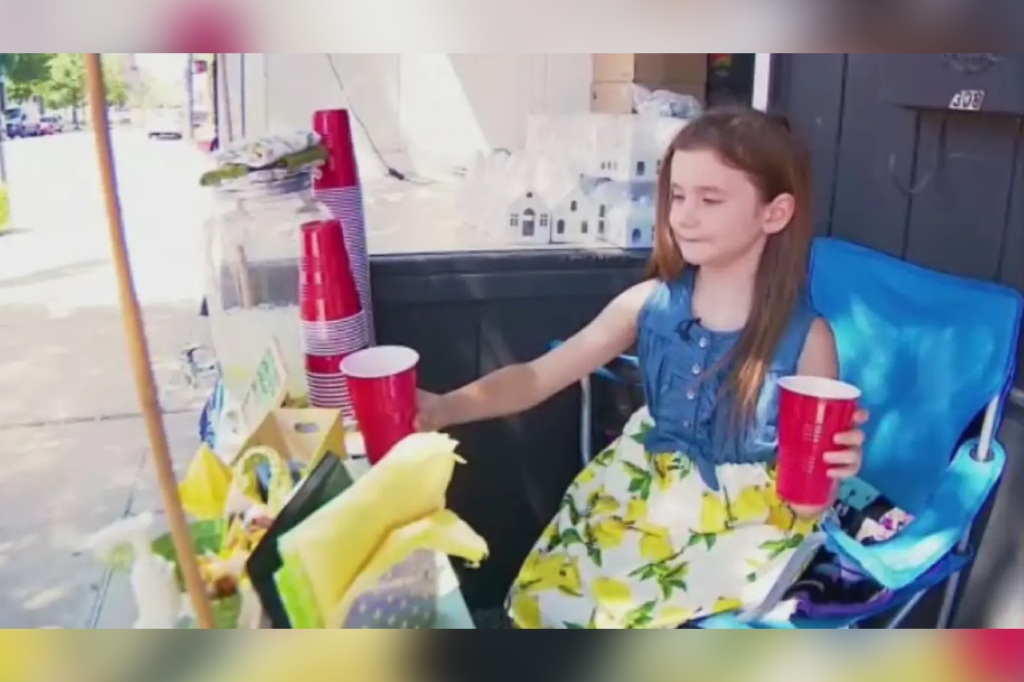 Girl at lemonade stand.