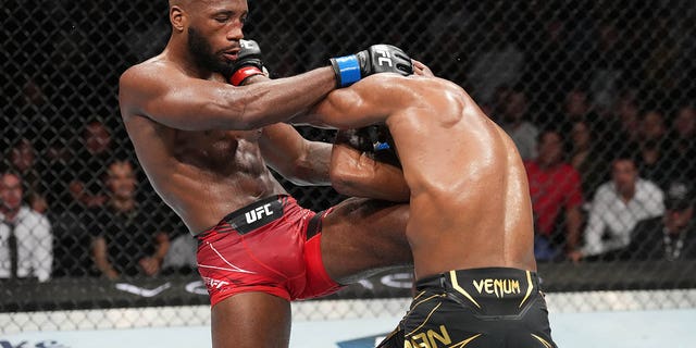 Leon Edwards knees Kamaru Usman in the UFC welterweight championship fight during the UFC 278 on Aug. 20, 2022, in Salt Lake City, Utah.