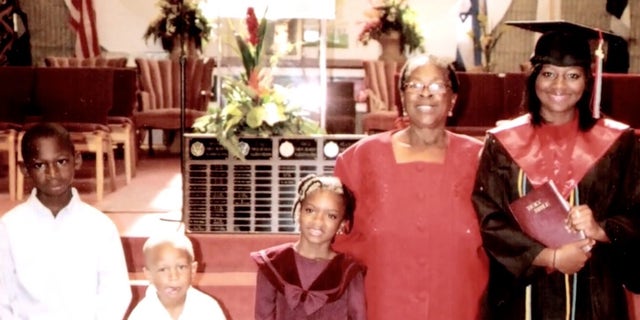 Denisha Merriweather alongside her godmother and family members.