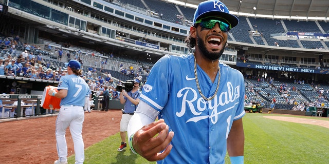 Kansas City Royals' MJ Melendez, reacts after getting doused by Bobby Witt Jr., as they celebrate their team's 13-5 win over the Boston Red Sox at the end of a baseball game in Kansas City, Mo., Sunday, Aug. 7, 2022.