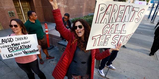 A mother of children in the Los Angeles Unified School District joins members of Los Angeles Leftists for Choice and Unity as they held a rally against the LAUSD student COVID-19 vaccination mandate outside the Stanley Mosk Courthouse.