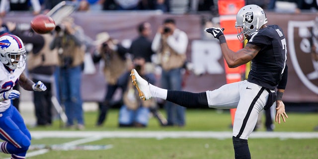 Punter Marquette King, #7 of the Oakland Raiders, sends the ball for 68 yards against the Buffalo Bills late in the fourth quarter on December 4, 2016 at Oakland-Alameda County Coliseum in Oakland, California. 