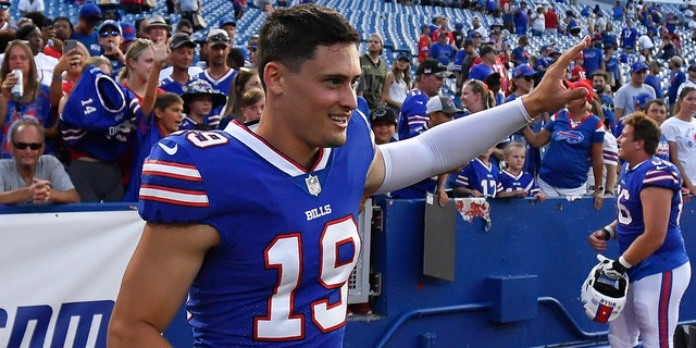 Buffalo Bills punter Matt Araiza waves to fans after a preseason game against the Indianapolis Colts in Orchard Park, N.Y., Aug. 13, 2022. 