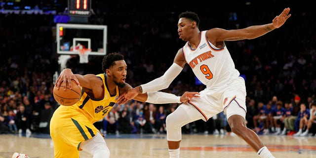 Donovan Mitchell, #45 of the Utah Jazz, dribbles against RJ Barrett, #9 of the New York Knicks, during the second half at Madison Square Garden on March 20, 2022 in New York City. The Jazz won 108-93.