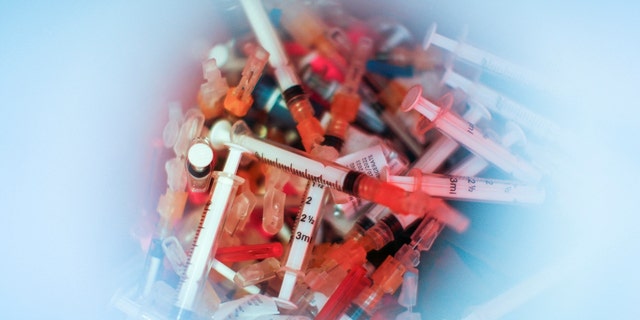 Syringes used for the monkeypox vaccine are seen inside of a bucket in a drive-through monkeypox vaccination point at the Westchester Medical Center in Valhalla, New York, U.S., July 28, 2022. 