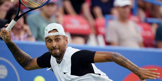 Nick Kyrgios, of Australia, prepares to hit a forehand to Marcos Giron, of the United States, at the Citi Open tennis tournament in Washington, Tuesday, Aug. 2, 2022. 