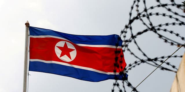 A North Korea flag flutters next to concertina wire at the North Korean embassy in Kuala Lumpur, Malaysia March 9, 2017.