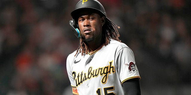 Oneil Cruz, #15 of the Pittsburgh Pirates, reacts as he walks back to the dugout after striking out against the San Francisco Giants in the top of the ninth inning at Oracle Park on August 13, 2022 in San Francisco.