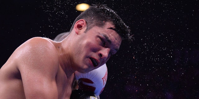 Omar Figueroa Jr (black trunks) and Yordenis Ugas (white trunks) box during their WBC welterweight title elimination bout at MGM Grand Garden Arena in Las Vegas July 20, 2019. Ugas won via unanimous decision.