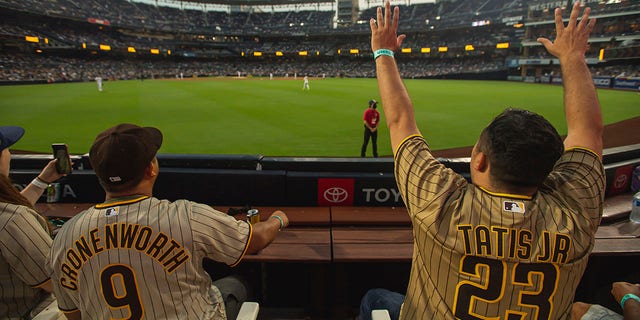 Fans cheer as the San Diego Padres face the Los Angeles Dodgers at Petco Park, Aug. 24, 2021, in San Diego, California.