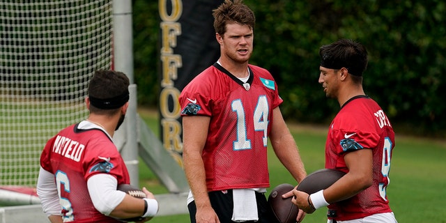 Carolina Panthers' Baker Mayfield, Sam Darnold and Matt Corral talk during the NFL football team's training camp in Gibbs Stadium at Wofford College on Saturday, July 30, 2022, in Spartanburg, S.C. 