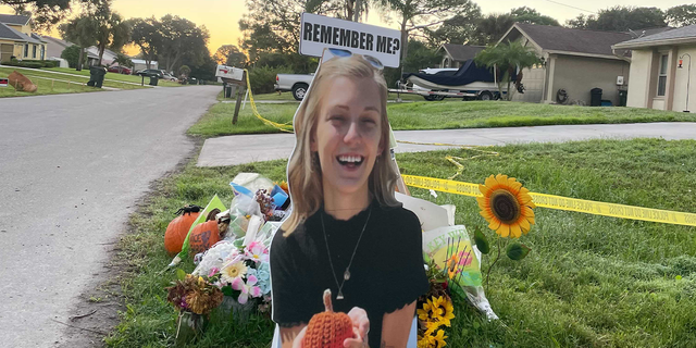 Mourners set up a makeshift memorial for Gabby Petito outside the Laundries' home in North Port, Florida.