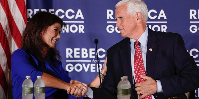 Former Vice President Mike Pence and GOP gubernatorial candidate and former Lt. Gov Rebecca Kleefisch of Wisconsin participate in a round table discussion Aug. 3, 2022, in Pewaukee, Wis. (AP Photo/Morry Gash, File)