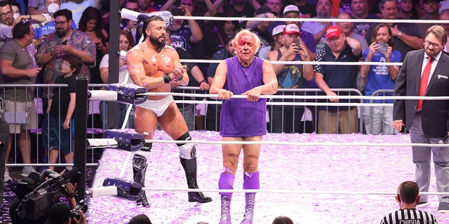 Andrade El Idolo and Ric Flair in action during Ric Flair's Last Match at Nashville Municipal Auditorium on July 31, 2022 in Nashville, Tennessee.