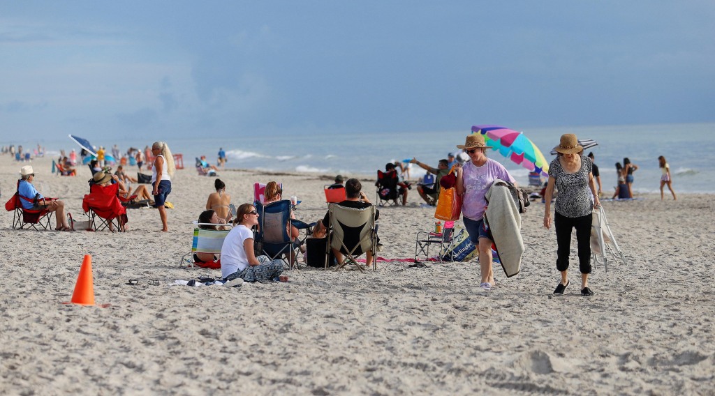 Spectators leave the beach after the launch of NASA’s next-generation moon rocket was delayed at Indialantic, Florida, on August 29, 2022. 