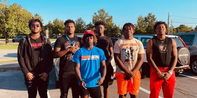 A group of Georgia high school football players who helped save a woman trapped in her car following a serious crash have been named honorary first responders.