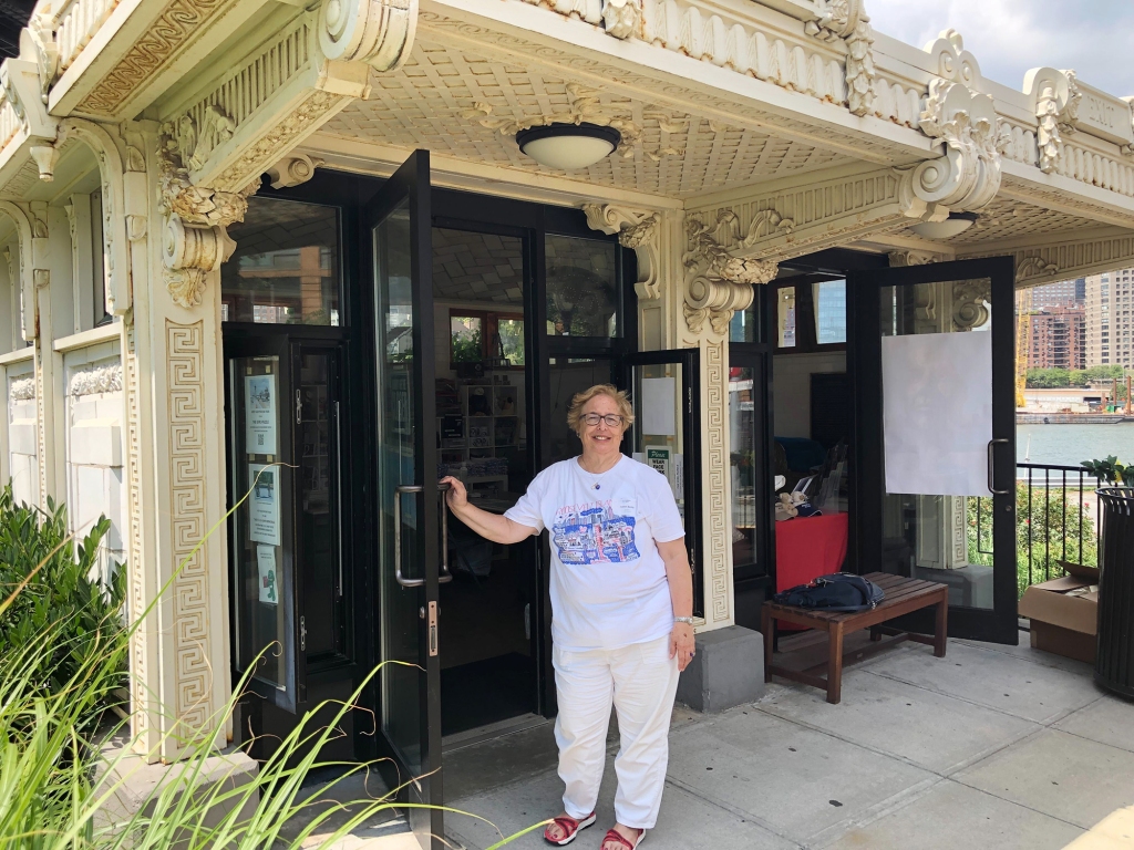 Roosevelt Island Historical Society President Judy Berdy wants a nearby vending cart to move so a long standing kiosk on Roosevelt Island can do good business.