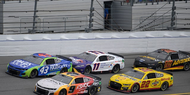 Chase Elliott (9), Erik Jones (43), Denny Hamlin (11), Joey Logano (22) and Ryan Blaney (12) make their way through the front stretch during the Coke Zero Sugar 400 at Daytona International Speedway in Daytona Beach, Florida, on Aug. 28, 2022.