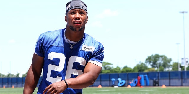 Running back Saquon Barkley, #26 of the New York Giants, walks off the field after the team's mandatory minicamp at Quest Diagnostics Training Center on June 8, 2022 in East Rutherford, New Jersey.