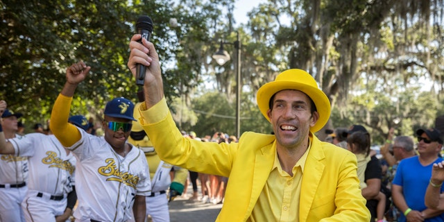 FILE - Savannah Bananas owner Jesse Cole emcees a pregame parade and performance for the fans before the gates opened Tuesday, June 7, 2022, in Savannah, Ga.