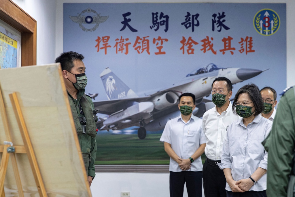 Taiwan's President Tsai Ing-wen looks on to a member of the island's military unit on Aug. 30, 2022. 