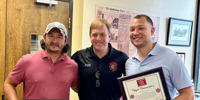 Fernando Rivera (left), Fire Chief Phil Hyman (center) and Sam Triplett (right).