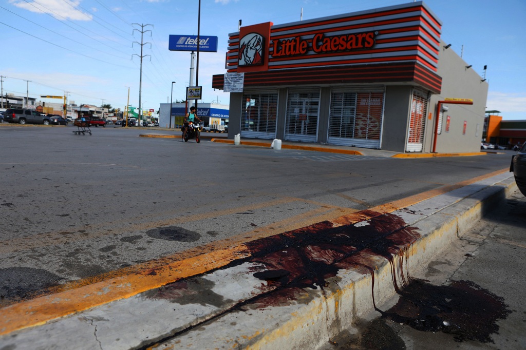 Blood stained sidewalk.