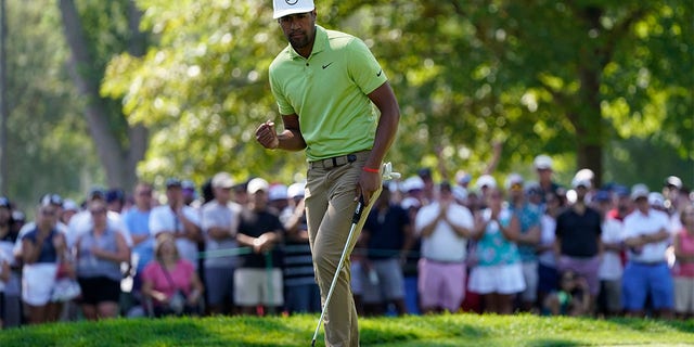 Tony Finau reacts after making his putt for par on the ninth green during the final round of the Rocket Mortgage Classic golf tournament, Sunday, July 31, 2022, in Detroit. 