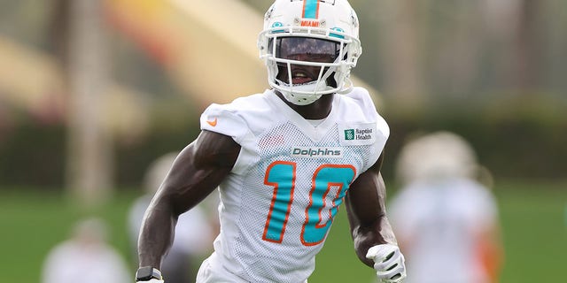 Tyreek Hill #10 of the Miami Dolphins catches a pass during training camp at Baptist Health Training Complex on July 27, 2022 in Miami Gardens, Florida.