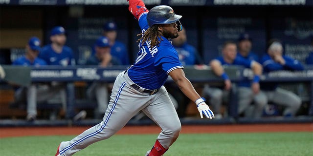 Toronto Blue Jays' Vladimir Guerrero Jr. singles off Tampa Bay Rays starting pitcher Drew Rasmussen during the third inning of a baseball game Tuesday, Aug. 2, 2022, in St. Petersburg, Fla. 