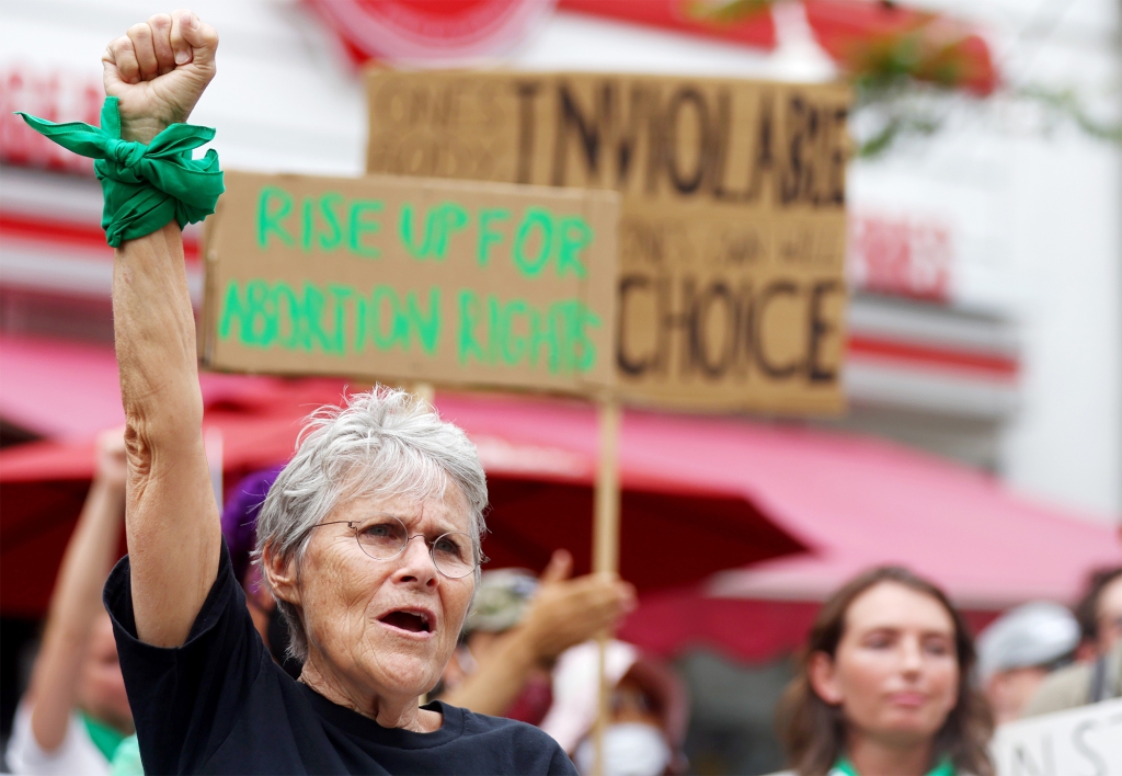 Abortion-rights activists demonstrate outside a Planned Parenthood clinic as they safeguard the clinic from a possible protest by a far-right group on July 16, 2022.