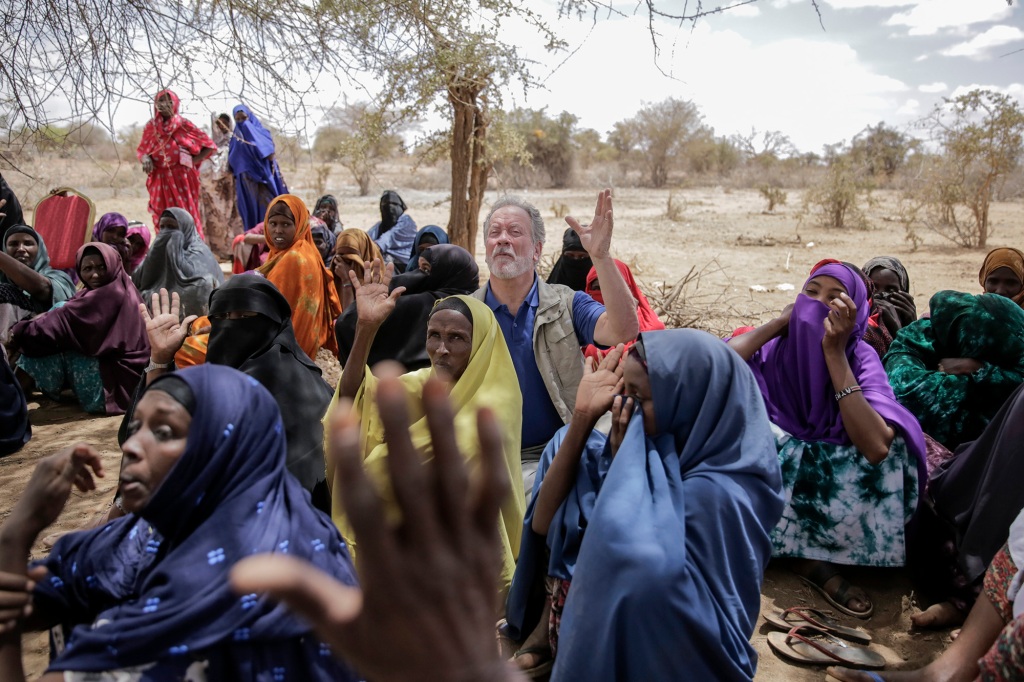 World Food Program chief David Beasley meets with villagers in the village of Wagalla.