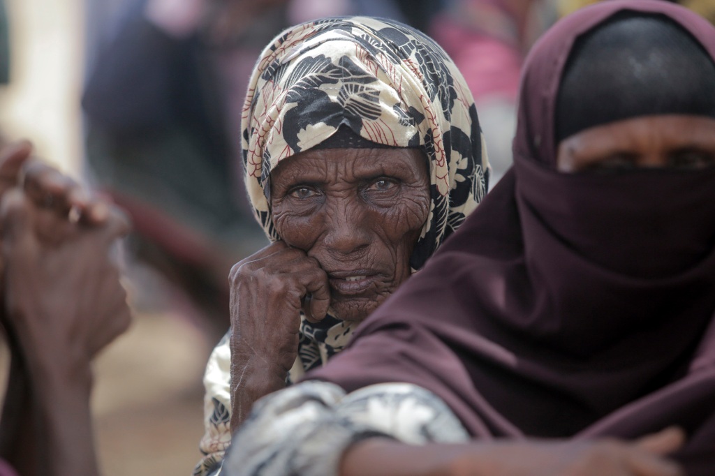 Villagers gather during a visit by World Food Program chief David Beasley in Kenya.