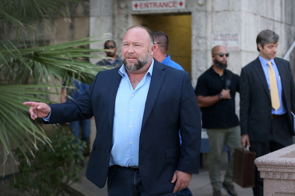 Alex Jones steps outside of the Travis County Courthouse.
