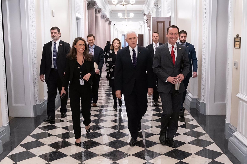 Alyssa Farah Griffin walks with then-Vice President Mike Pence. 