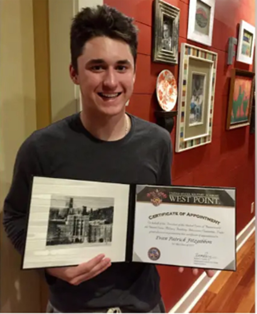 An 18-year-old Evan Fitzgibbon shows off his Certification of Appointment to West Point Academy. 